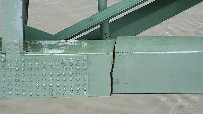 In this undated image released by the Tennessee Department of Transportation, a crack is visible in a steel beam on the Interstate 40 bridge near Memphis. The Tennessee Department of Transportation says the crack was in a 900-foot steel beam that provides stability for the Interstate 40 bridge that connects Arkansas and Tennessee over the Mississippi River. The bridge was closed Tuesday, May 11, 2021 after inspectors found the crack. (Tennessee Department of Transportation via AP)