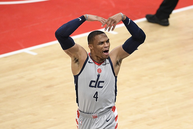 Washington Wizards guard Russell Westbrook reacts to the crowd during the second half of the team's NBA basketball Eastern Conference play-in game against the Indiana Pacers, Thursday, May 20, 2021, in Washington. (AP Photo/Nick Wass)