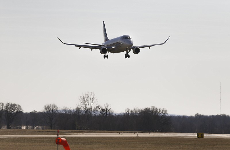 FILE -- A commercial plane lands, Friday, January 23, 2021 at the Northwest Arkansas National Airport in Bentonville. (NWA Democrat-Gazette/Charlie Kaijo)
