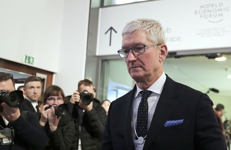 FILE - In this Tuesday, Jan. 21, 2020, file photo, Apple CEO Tim Cook is photographed at the World Economic Forum in Davos, Switzerland. Cook will take the witness stand Friday, May 21, 2021, to defend the company’s iPhone app store against charges that it has grown into an illegal monopoly, one far more profitable than his predecessor Steve Jobs ever envisioned. (AP Photo/Markus Schreiber, File)