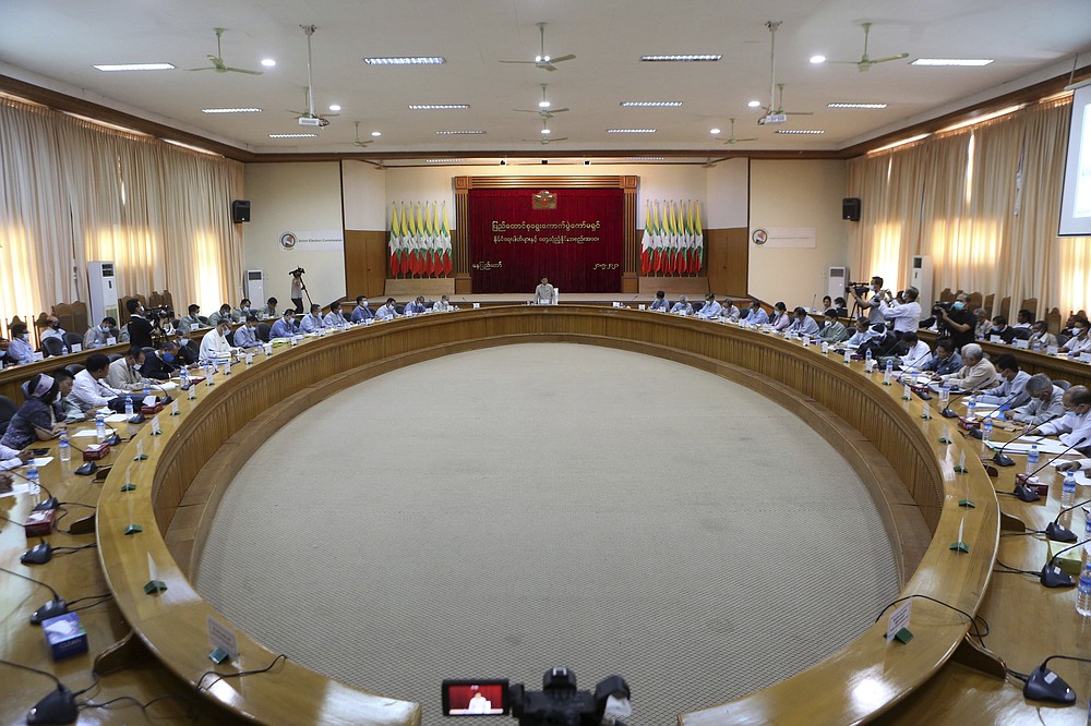 The Union Election Commission meets with representatives of various political parties Friday, May 21, 2021, in Naypyitaw, Burma. The head of Burma's military-appointed state election commission said Friday his agency will consider dissolving the former ruling party of Aung San Suu Kyi for its alleged involvement in electoral fraud, and have its leaders charged with treason. (AP Photo)