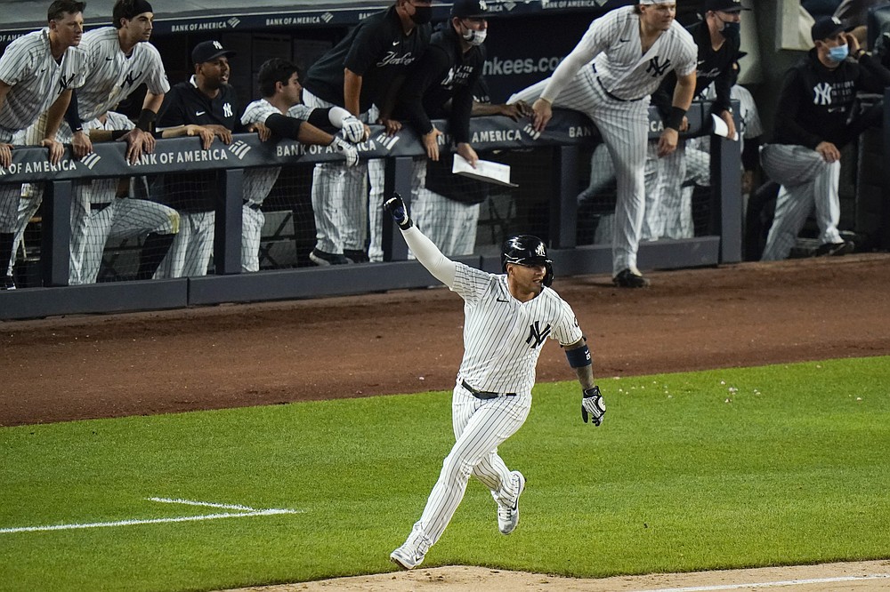 New York Yankees' Gleyber Torres celebrates after hitting an RBI-single to drive in the winning run during the ninth inning of a baseball game against the Chicago White Sox, Friday, May 21, 2021, in New York. The Yankees won 2-1. (AP Photo/Frank Franklin II)