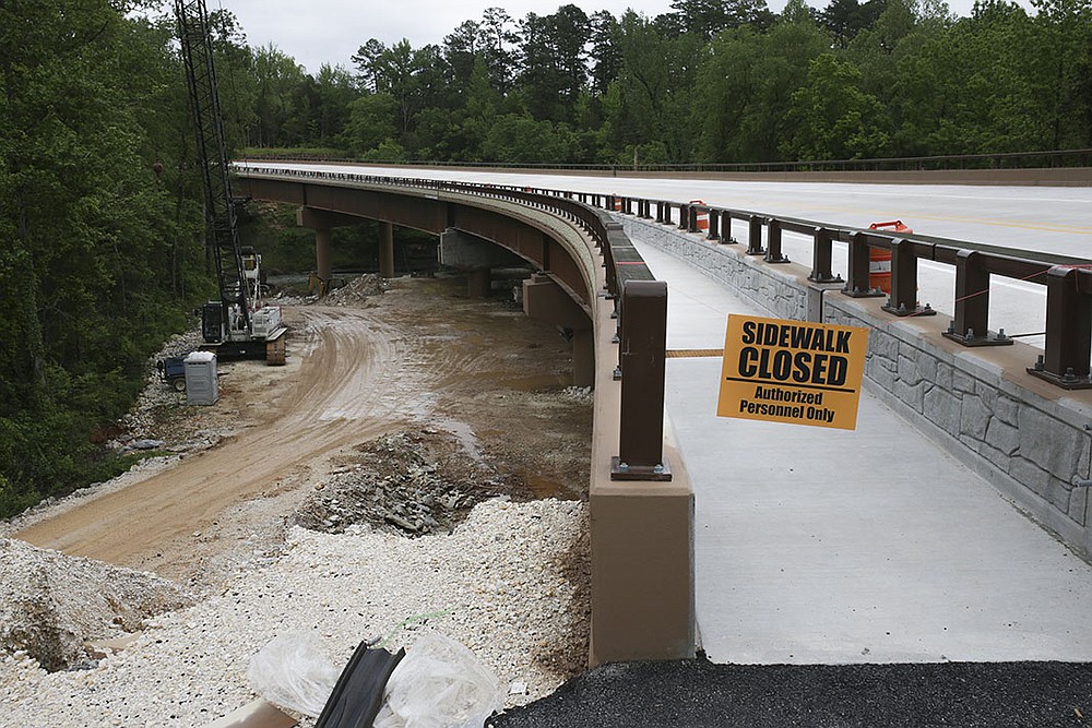 A walkway on the new bridge at Pruitt is almost ready for use. The bridge also has about 12 feet of clearance underneath, high enough for horseback riders to stay on the Old River Trail. Previously, they had to make a dangerous crossing on the old bridge.
(NWA Democrat-Gazette/Charlie Kaijo)