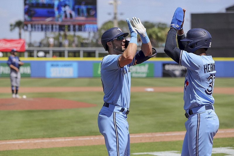 Toronto Blue Jays' Randal Grichuk celebrates his two-run home run with Teoscar Hernandez during the eighth inning of a baseball game Sunday, May 23, 2021, in Dunedin, Fla. (AP Photo/Mike Carlson)