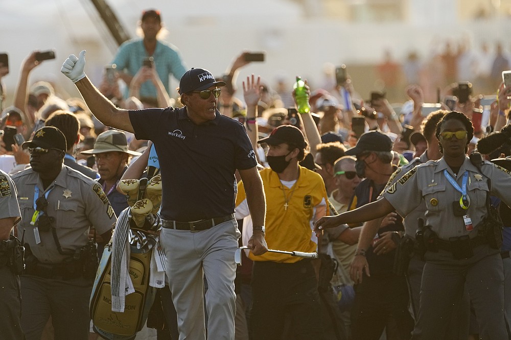 Phil Mickelson walks ahead of spectators during the final round at the PGA Championship golf tournament on the Ocean Course, Sunday, May 23, 2021, in Kiawah Island, S.C. (AP Photo/David J. Phillip)