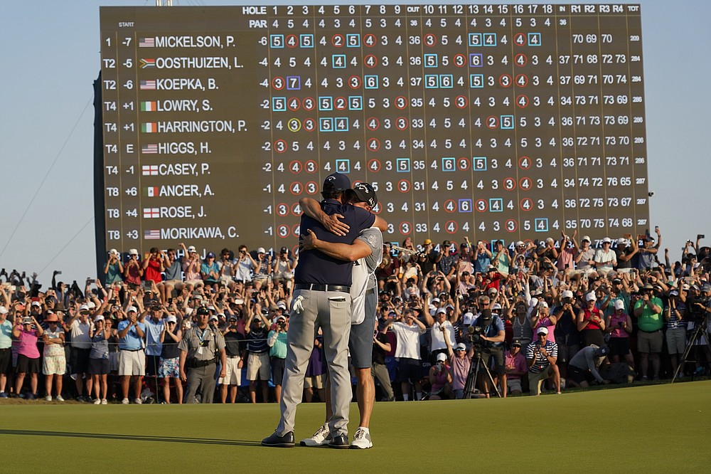 Phil Mickelson celebrates with his caddie and brother Tim after winning the final round at the PGA Championship golf tournament on the Ocean Course, Sunday, May 23, 2021, in Kiawah Island, S.C. (AP Photo/Chris Carlson)