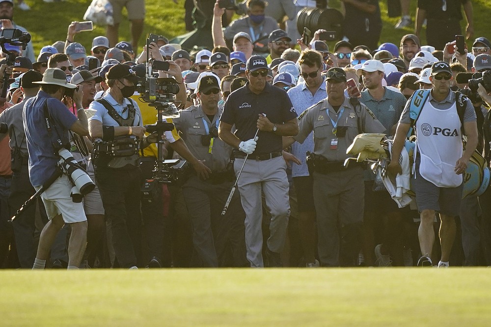 Phil Mickelson walks up the 18th fairway during the final round at the PGA Championship golf tournament on the Ocean Course, Sunday, May 23, 2021, in Kiawah Island, S.C. (AP Photo/Matt York)