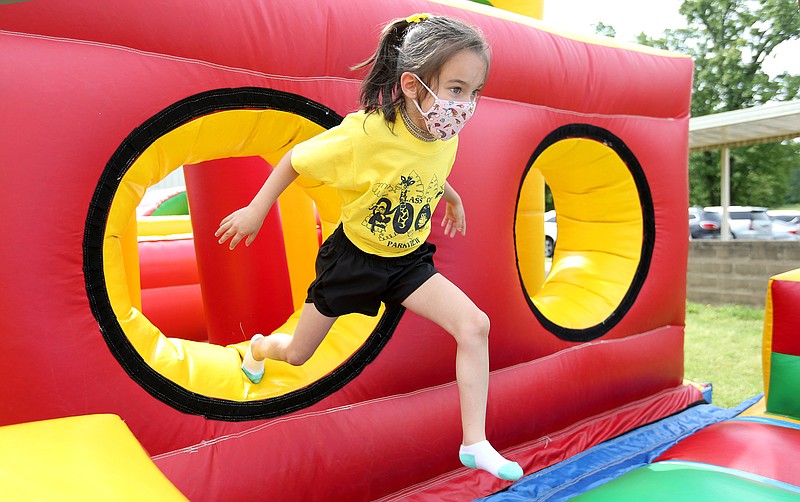 Emerson Seata, a kindergarten student at Vandergriff Elementary School, races out of an inflated tunnel, Monday as she participates with her class during Field Day 2021 at the school in Fayetteville. The students participated in several relay events including an egg relay and also the inflatable obstacle course. Check out nwaonline.com/210525Daily/ and nwadg.com/photos for a photo gallery.

(NWA Democrat-Gazette/David Gottschalk)