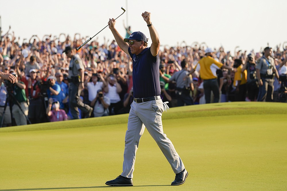 Phil Mickelson celebrates after winning the final round at the PGA Championship golf tournament on the Ocean Course, Sunday, May 23, 2021, in Kiawah Island, S.C. (AP Photo/David J. Phillip)