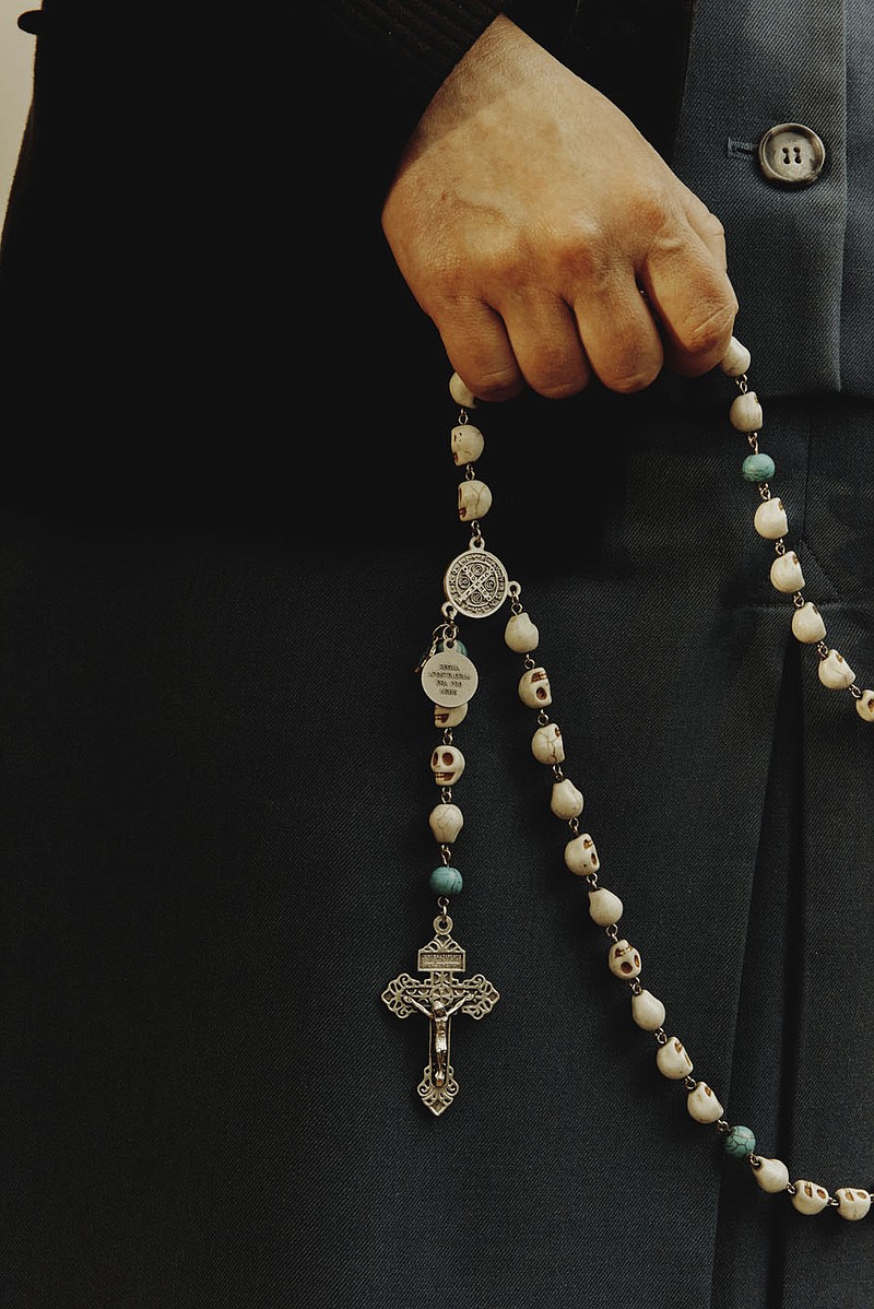 Sister Theresa Aletheia Noble holds a rosary with skull beads at Daughters of St. Paul convent in Boston, May 12, 2021. Since 2017, Sister Aletheia has made it her mission to revive the practice of memento mori, a Latin phrase meaning “Remember your death,” which encourages intentional thought about one’s death every day as a means of appreciating the present and focusing on the future. (Tony Luong/The New York Times)