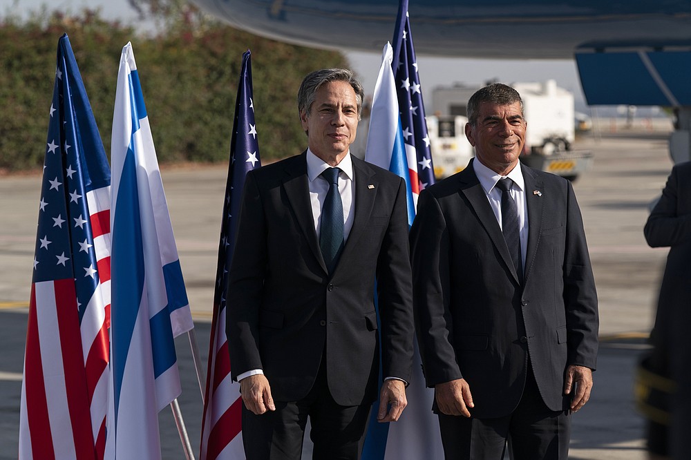 Secretary of State Antony Blinken, left, stands with Israeli Foreign Minister Gabi Ashkenazi, upon arrival at Tel Aviv Ben Gurion Airport, Tuesday, May 25, 2021, in Tel Aviv, Israel. Blinken has arrived in Israel at the start of a Middle East tour aimed at shoring up the Gaza cease-fire. (AP Photo/Alex Brandon, Pool)