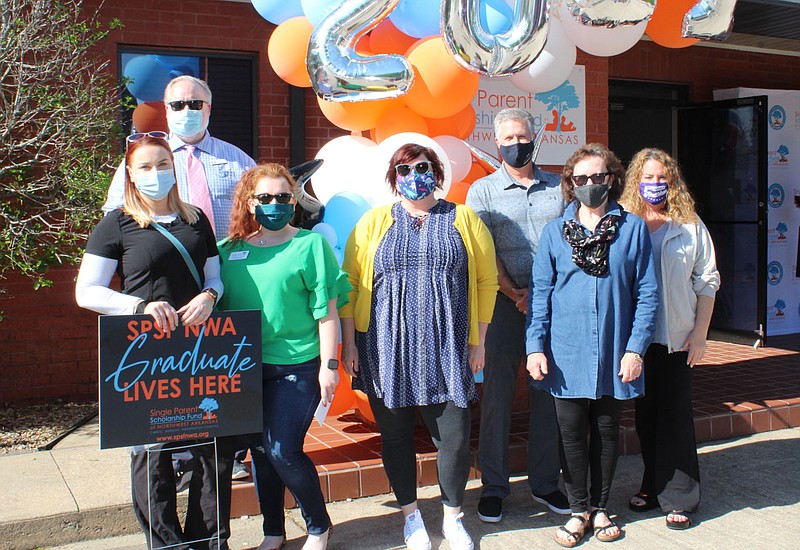 Tenessa Wroten (from left), Darrell Annis, Katie Marie Glenn, Jennifer McCool, Jim Ed Summers, Lolly Greenwood and Joy Morris gather to congratulate Single Parent Scholarship Fund of Northwest Arkansas 2021 graduates.
(NWA Democrat-Gazette/Carin Schoppmeyer)