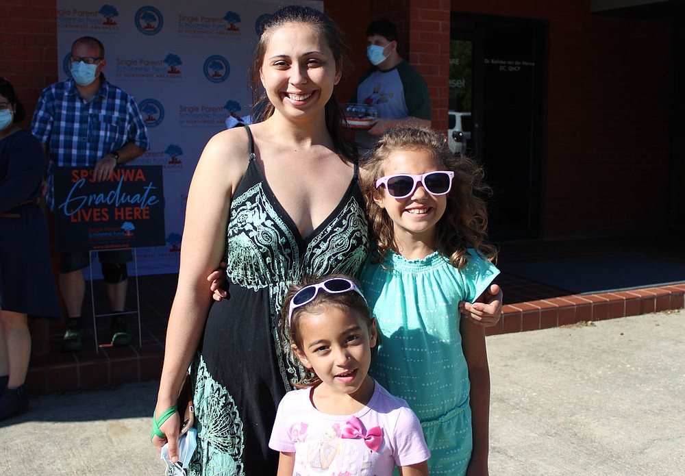 Destiny Draper, 2021 graduate (from left) and daughters Alayna Wade and Aubriella Wade attend the graduation celebration.
(NWA Democrat-Gazette/Carin Schoppmeyer)