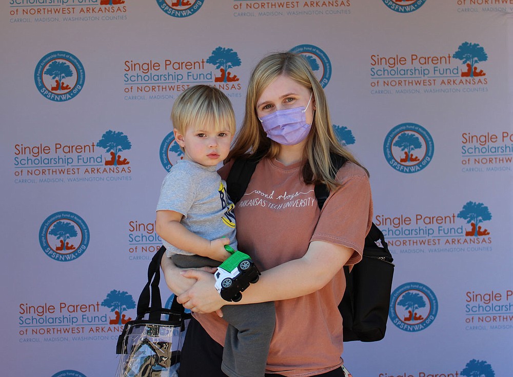 Elizabeth Boone and son Eliott Weber stand for a photo at the graduation celebration.
(NWA Democrat-Gazette/Carin Schoppmeyer)