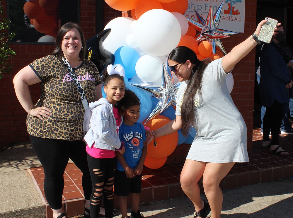 Melissa Coleman (from left) with her children Aaleyiah Wright and LaRenzo Wright and sister Aamani Coleman celebrate Melissa’s graduation.
(NWA Democrat-Gazette/Carin Schoppmeyer)