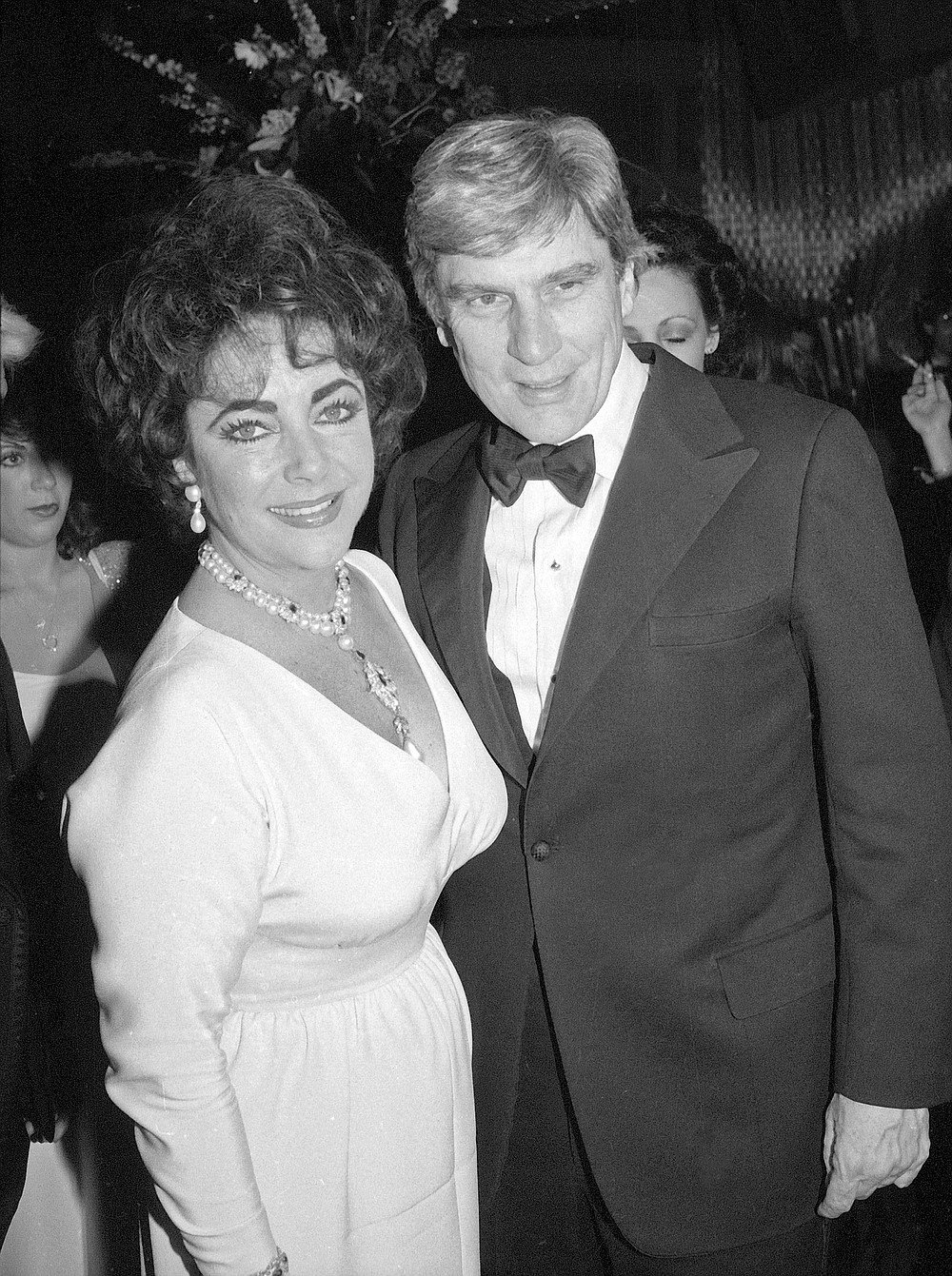 FILE - In this May 7, 1981 file photo actress Elizabeth Taylor and her husband Sen. John Warner, R-Va., arrive at Xenon disco in New York. Warner, a former Navy secretary and one of the Senate’s most influential military experts, died Tuesday, May 25, 2021, at age 94, his longtime chief of staff said Wednesday, May 26 (AP Photo/Richard Drew, File)