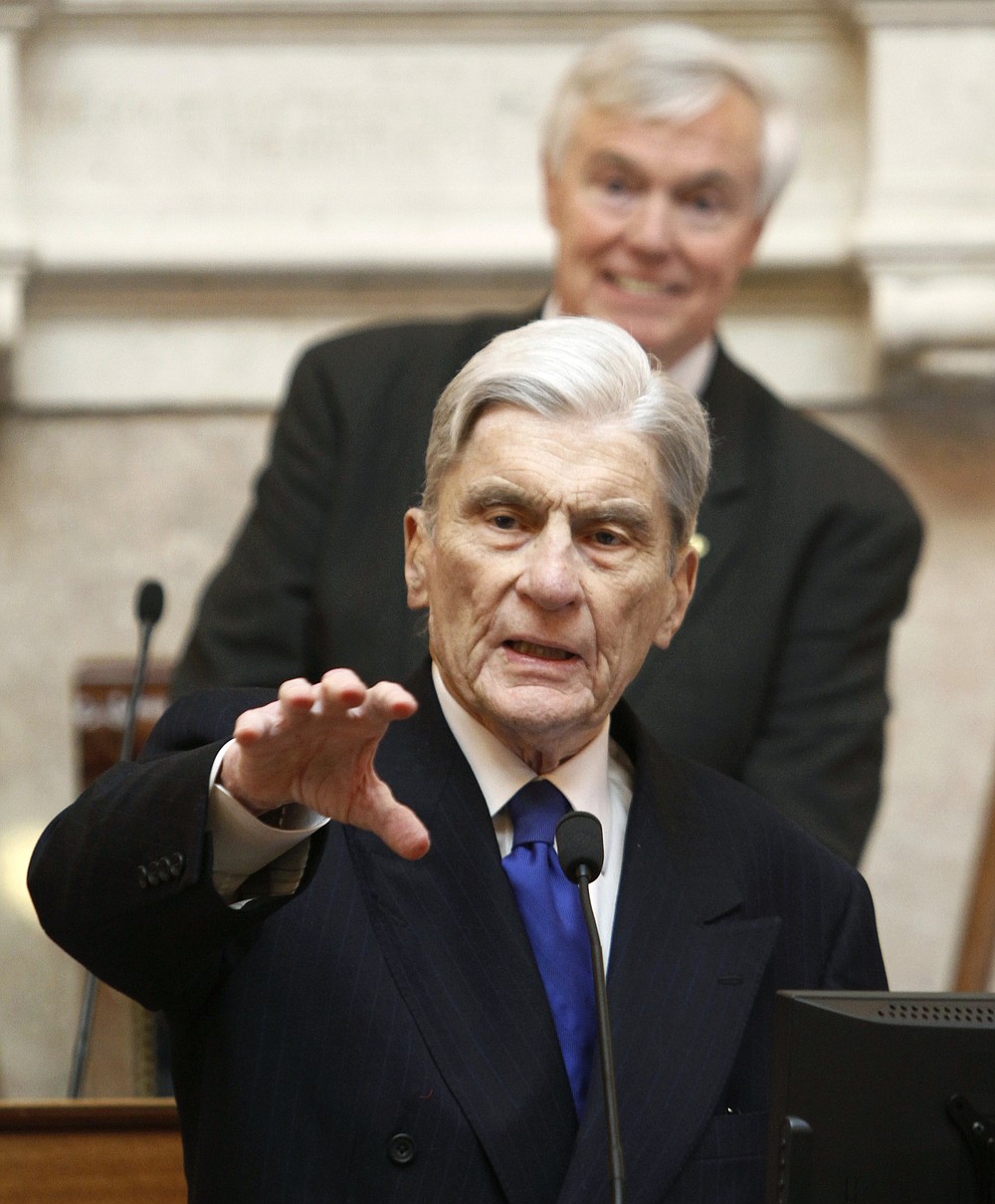 FILE - In this Jan. 18, 2012 file photo former U.S. Sen. John Warner of Virginia speaks to the Virginia House of Delegates as House speaker, William Howell, R-Stafford, top, listens, at the Capitol in Richmond, Va. Warner, a former Navy secretary who was once married to Elizabeth Taylor, died Tuesday, May 25, 2021, at 94, his longtime chief of staff said Wednesday, May 26.(AP Photo/Steve Helber, File)