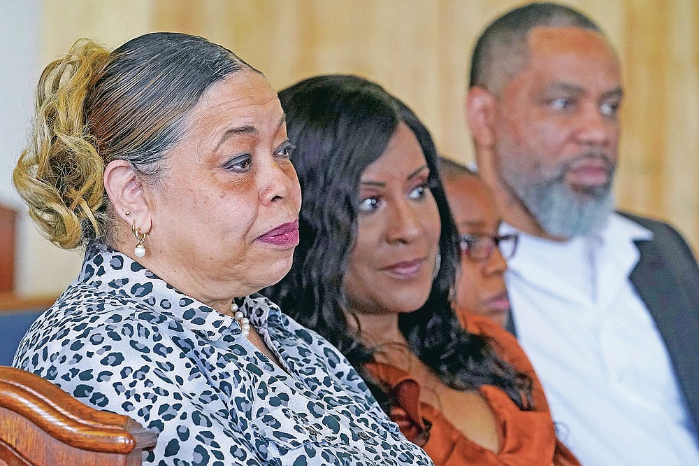 Descendants of Tulsa Race Massacre survivor Ernestine Alpha Gibbs sit together during an interview in Tulsa, Okla., on Sunday, April 11, 2021. From left are her daughter, Carolyn Roberts; granddaughter-in-law, Tracy Gibbs; great-grandson, LeRoy Gibbs III, and grandson LeRoy Gibbs II. LeRoy II credits his grandmother, who not only built wealth and passed it on, but also showed succeeding generations how it was done. It was a lesson that few descendants of the victims of the race massacre had an opportunity to learn. “The perseverance of it is what she tried to pass on to me,” said LeRoy Gibbs II. “We were fortunate that we had Ernestine and LeRoy … They built their business.” (AP Photo/Sue Ogrocki)