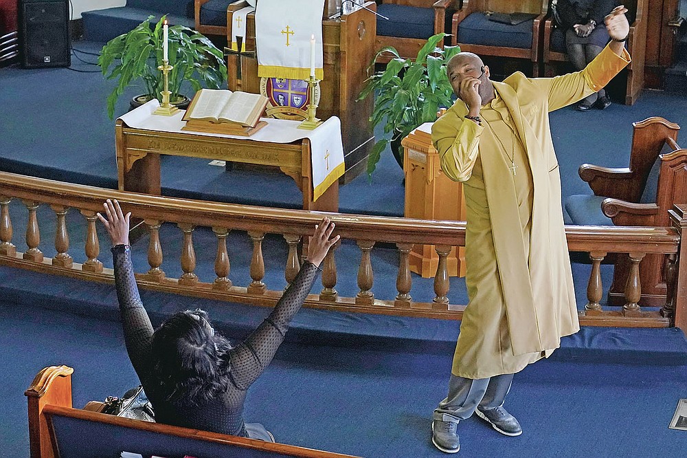 The Rev. Robert Turner, pastor of the Historic Vernon African Methodist Episcopal Church, conducts a service at the church in Tulsa, Okla., on Sunday, April 11, 2021. Speaking about the 1921 Tulsa Race Massacre, he says, “What happened in Tulsa wasn’t just unique to Tulsa. This happened all over the country. It was just that Tulsa was the largest. It damaged our community. And we haven’t rebounded since. I think it’s past time that justice be done to atone for that.” (AP Photo/Sue Ogrocki)