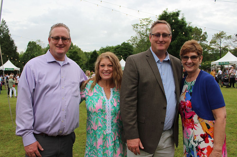 Bryan and Cari Lewis (from left), Steve Lewis and Nancy Pinkerton enjoy Chefs in the Garden.
(NWA Democrat-Gazette/Carin Schoppmeyer)