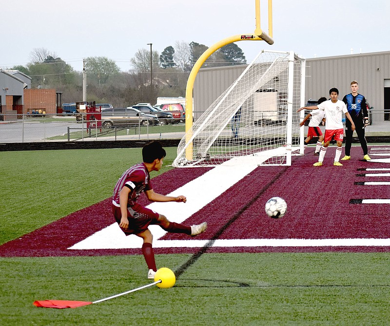 MARK HUMPHREY  ENTERPRISE-LEADER/Lincoln junior Rafael Regaldo executes a corner kick against Eureka Springs. The speedy forward set a state record by scoring six goals in a single match during an 8-2 road win by the Wolves at Lead Hill on April 22.
