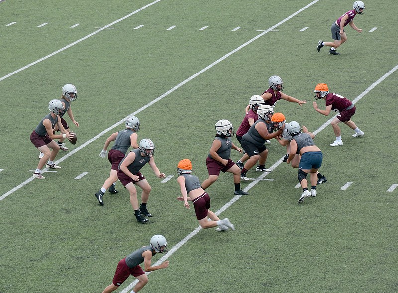 Graham Thomas/Herald-Leader
Siloam Springs football players work during practice on the last day of school Friday, May 28. The Panthers are scheduled to begin their summer workout program on Monday, June 7.
