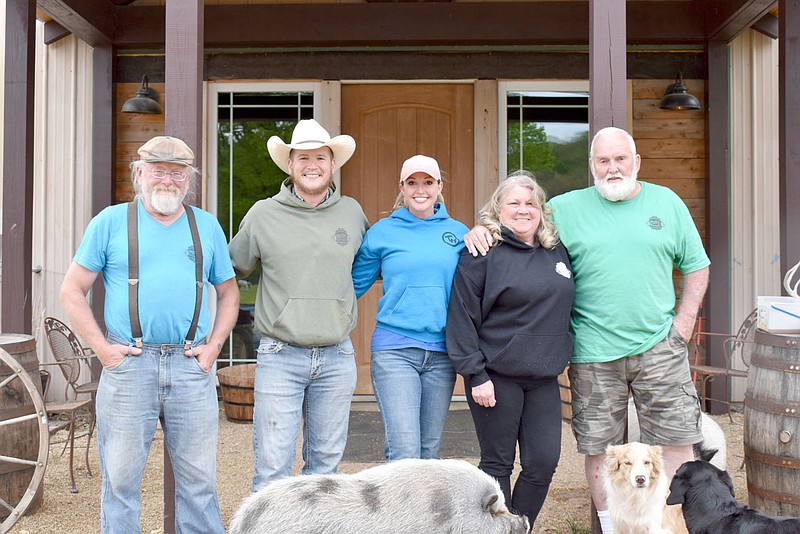 RACHEL DICKERSON/MCDONALD COUNTY PRESS Chris Nogy, left, Steven Myers, Summer Myers, Pam Davis and Richard Davis are pictured on the front porch of Whistling Springs Brewery in Jacket.