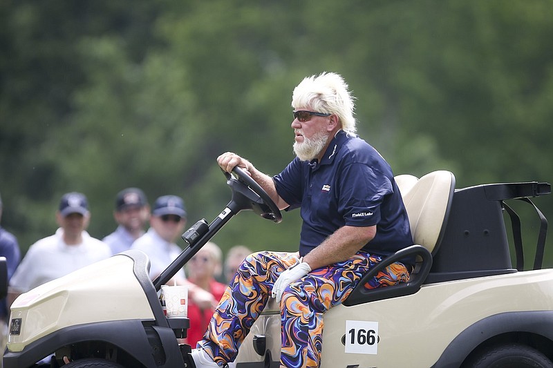 John Daly rides in a golf cart Thursday during the first round of the Senior PGA Championship at Southern Hills in Tulsa, Okla. - Photo by Ian Maule/Tulsa World via The Associated Press