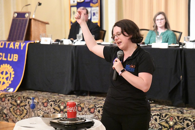 Casey Wylie, director of education at Mid-America Science Museum, does a science demonstration at Hot Springs National Park Rotary Club on Wednesday. - Photo by Tanner Newton of The Sentinel-Record
