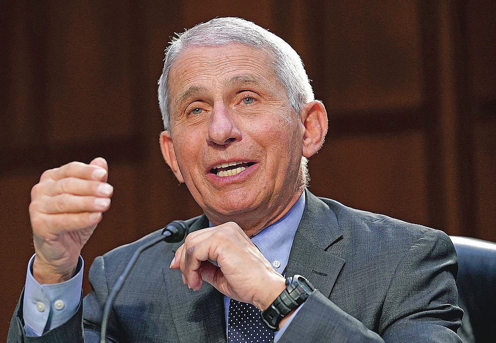 FILE - In this March 18, 2021 file photo, Dr. Anthony Fauci, director of the National Institute of Allergy and Infectious Diseases, testifies during a Senate Health, Education, Labor and Pensions Committee hearing on the federal coronavirus response on Capitol Hill in Washington. On Friday, May 28, 2021, The Associated Press reported on stories circulating online incorrectly asserting that the front page of a New York Post newspaper shows an image of Fauci under the headline, “Triggered ‘gay cancer’ epidemic in the U.S. THE MAN WHO GAVE US AIDS,” to give the false impression that a 1987 article was about him. The Post did run that headline on Oct. 6, 1987, but the actual story was about a different individual and did not mention Fauci -- nor did it include his photo. (AP Photo/Susan Walsh, Pool, File)