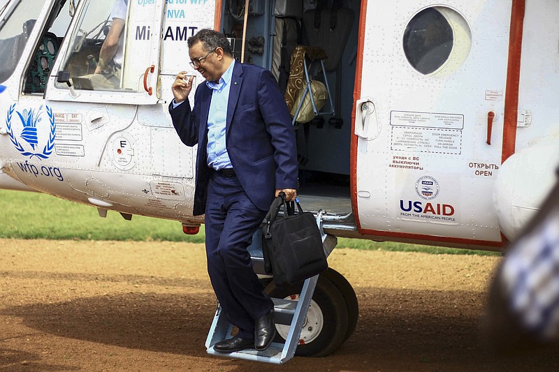 FILE - In this Saturday, June 15, 2019 file photo, World Health Organization Director-General Tedros Adhanom Ghebreyesus arrives by helicopter at Ruhenda airport in Butembo, eastern Congo, to visit operations aimed at preventing the spread of Ebola and treating its victims. The head of the World Health Organization acknowledged the U.N. agency’s response to allegations of sexual abuse perpetrated by its own staffers during an Ebola outbreak in Congo was “slow” after being pressed on the issue by numerous countries following an Associated Press investigation that revealed senior management were informed about sexual misconduct complaints. (AP Photo/Kudra Maliro, File)