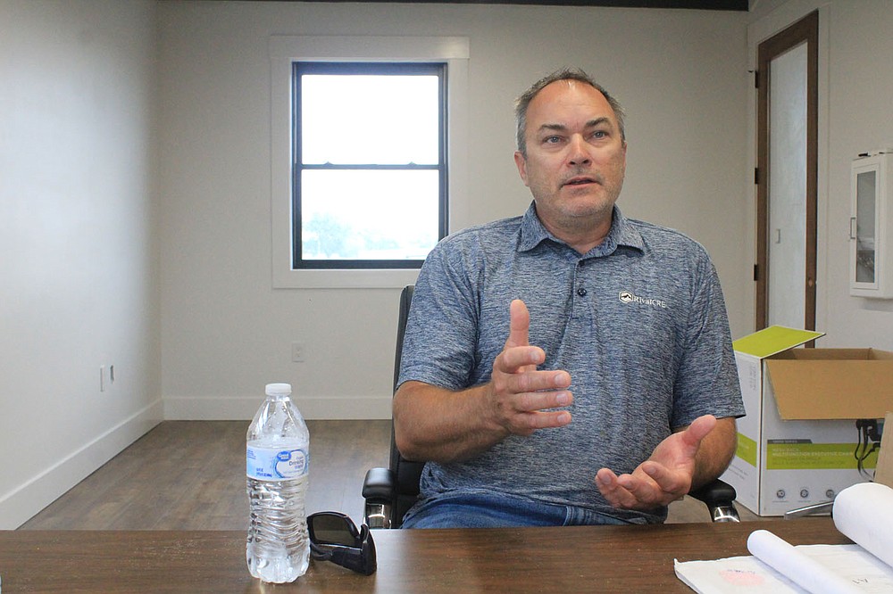Lloyd Sumpter of Rival CRE discusses the renovation of the barracks and buildings in the Buckhorn Street district on Thursday, May 27, 2021, inside one of the buildings.