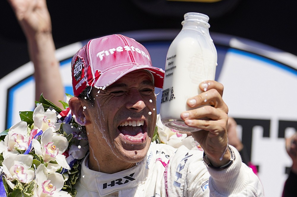 Helio Castroneves, of Brazil, celebrates after winning the Indianapolis 500 auto race at Indianapolis Motor Speedway in Indianapolis, Sunday, May 30, 2021. (AP Photo/Michael Conroy)