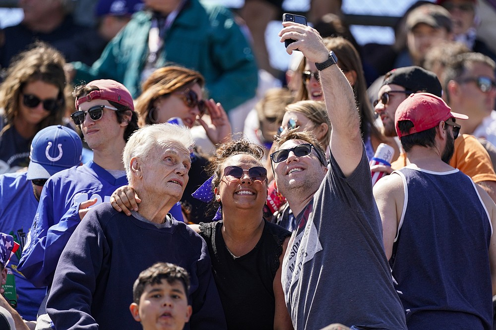 Fans take a photo before the Indianapolis 500 auto race at Indianapolis Motor Speedway in Indianapolis, Sunday, May 30, 2021. (AP Photo/Darron Cummings)