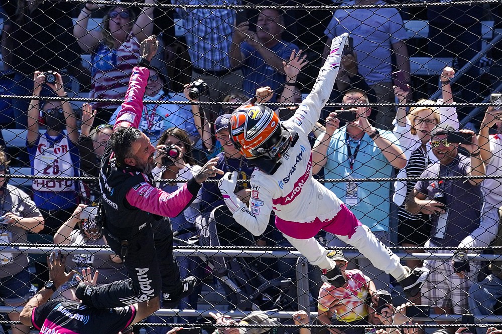 Helio Castroneves, right, of Brazil, celebrates after winning the Indianapolis 500 auto race at Indianapolis Motor Speedway in Indianapolis, Sunday, May 30, 2021. (AP Photo/Darron Cummings)