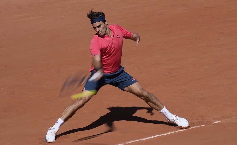 Switzerland's Roger Federer plays a return to Uzbekistan's Denis Istomin during their first round match on day two of the French Open tennis tournament at Roland Garros in Paris, France, Monday, May 31, 2021. (AP Photo/Thibault Camus)
