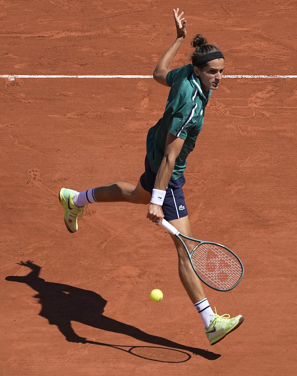 Pierre-Hugues Herbert of France plays a return to Italy's Jannik Sinner during their first round match on day two of the French Open tennis tournament at Roland Garros in Paris, France, Monday, May 31, 2021. (AP Photo/Michel Euler)