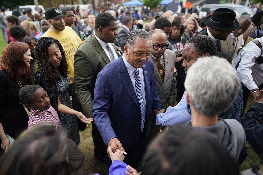 Rev. Jesse Jackson meets people after the dedication of a prayer wall outside of the historic Vernon African Methodist Episcopal Church in the Greenwood neighborhood during the centennial of the Tulsa Race Massacre, Monday, May 31, 2021, in Tulsa, Okla. The church was largely destroyed when a white mob descended on the prosperous Black neighborhood in 1921, burning, killing, looting and leveling a 35-square-block area. (AP Photo/John Locher)