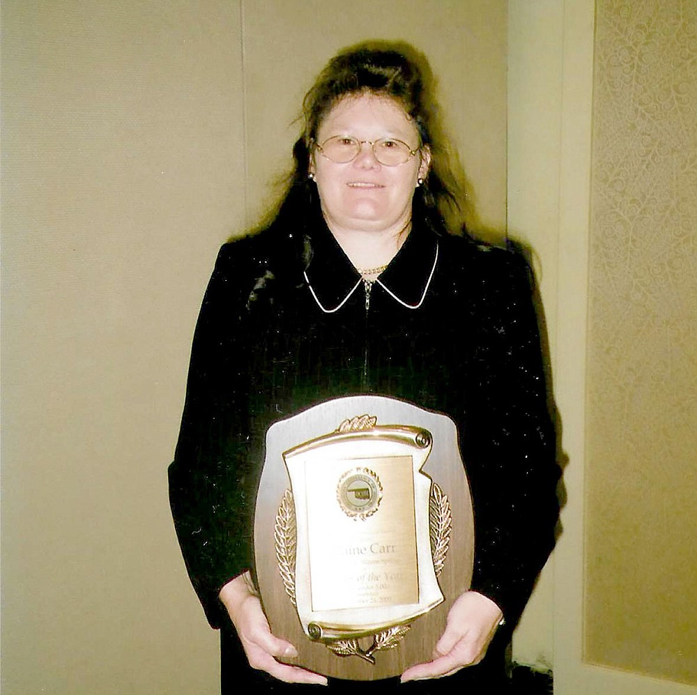 Photo Submitted Elaine Carr is all smiles as she poses with her Mayor of the Year award for people under 5,000.  Carr won the award in 2009 and considers it a great honor.