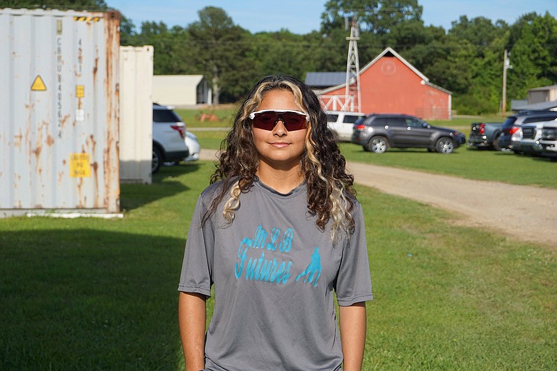 Jessieville catcher Violet Mendez stands outside a baseball field in Lonsdale. - Photo by Krishnan Collins of The Sentinel-Record