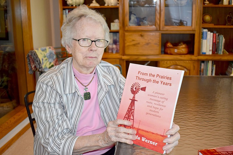 Rachel Dickerson/The Weekly Vista Wilda Werner of Bella Vista is pictured with a book she wrote about her life story. She wrote it while staying at home during the pandemic.