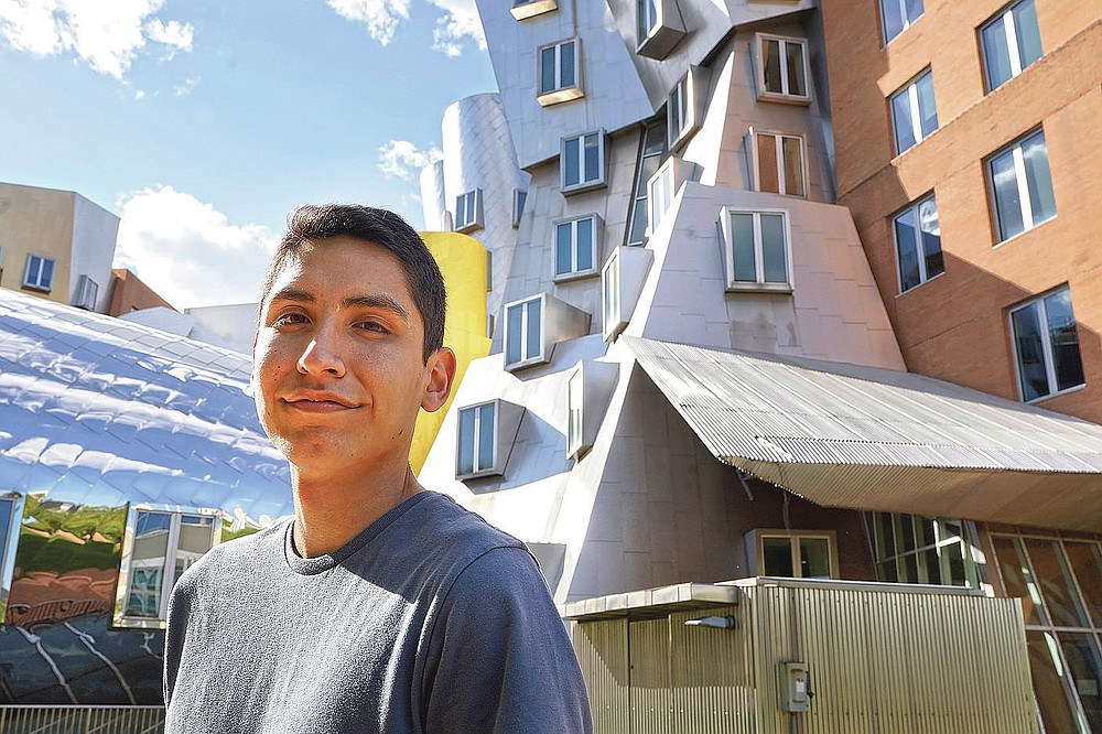 HOLD TO RELEASE 1:00 A.M. THURSDAY WITH STORY BY PHIL MARCELO — Luke Bastian, a 22-year-old Navajo student from Phoenix, stands for a photograph Thursday, May 13, 2021, on the campus of Massachusetts Institute of Technology, in Cambridge, Mass. Bastian says he and other students presented their class projects to MIT's president earlier this month in the hopes of convincing the institution to create a Native American studies program. (AP Photo/Steven Senne)