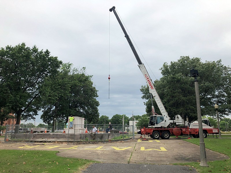 A heavy crane that will be used to help dig up the remains of former Confederate Gen. Nathan Bedford Forrest sits at a park on Tuesday, June 1, 2021, in Memphis, Tenn. The bodies of Forrest and his wife are being moved from the Memphis park, where they have been buried for decades, to a museum in Middle Tennessee. (AP Photo/Adrian Sainz)