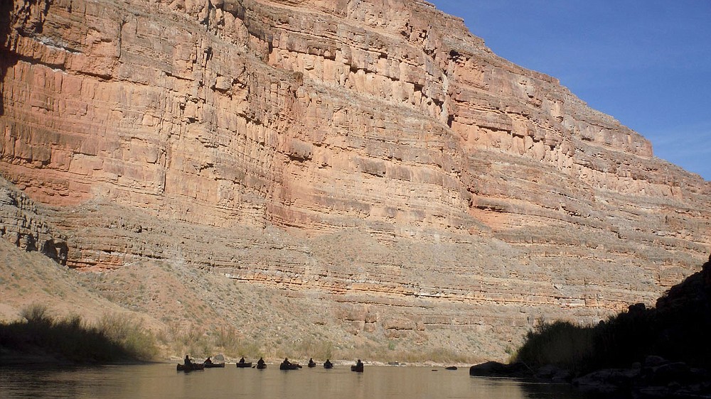 Nine of the 12 canoes are visible in April 2021 as they float the San Juan River through Slickhorn Canyon in southeast Utah. Sixteen people, including 12 canoes and a raft carrying four, paddled 83.5 miles of the San Juan River from the Sand Island Boat Ramp near Bluff, Ut., to Clay Hills Crossing UT.. Check out nwaonline.com/210608Daily/ and nwadg.com/photos for a photo gallery.
(NWA Democrat-Gazette/David Gottschalk)