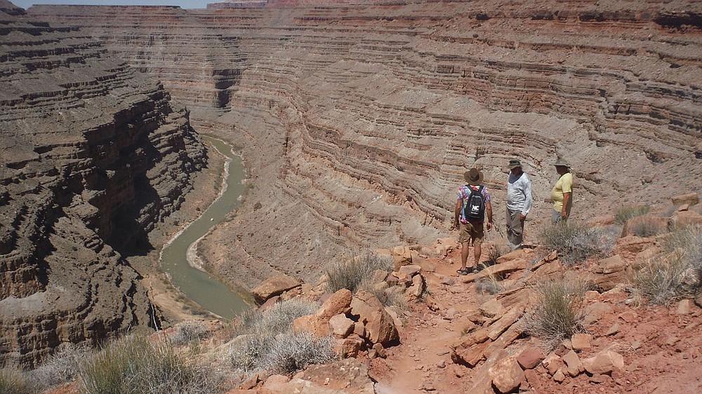 Bobby Cox (from left), Bob Kramer and Dan Held stop for the view on the Honaker Trail on the San Juan River.
(NWA Democrat-Gazette/David Gottschalk)