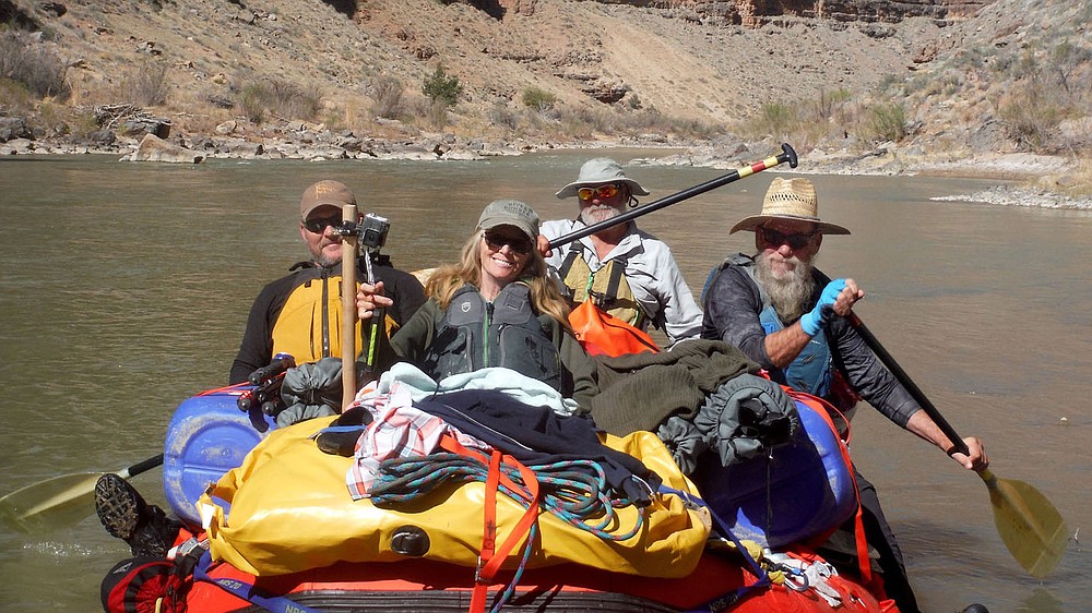 Chris Patrick (from left), Debbie Stillwell, Mark Weathers and Danny Stillwell paddle the raft on the San Juan River in southeast Utah. Sixteen people, including 12 canoes and a raft carrying four, paddled 83.5 miles of the San Juan River from the Sand Island Boat Ramp near Bluff, Ut., to Clay Hills Crossing UT.. Check out nwaonline.com/21____Daily/ and nwadg.com/photos for a photo gallery.
(NWA Democrat-Gazette/David Gottschalk)