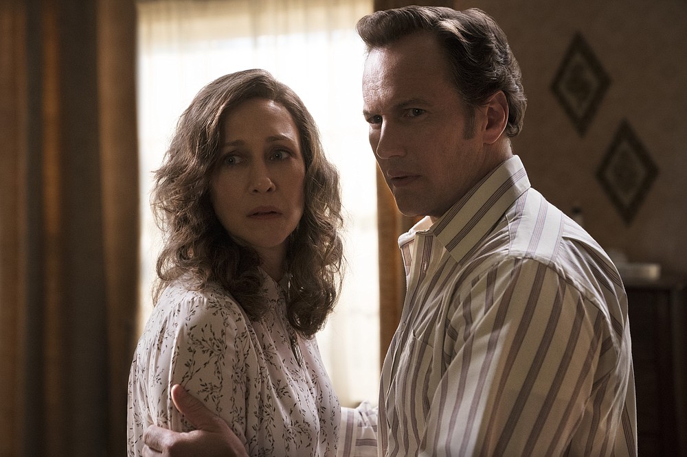 This image released by Warner Bros. Entertainment shows Vera Farmiga, left, and Patrick Wilson in a scene from "The Conjuring: The Devil Made Me Do It." (Ben Rothstein/Warner Bros. Entertainment via AP)