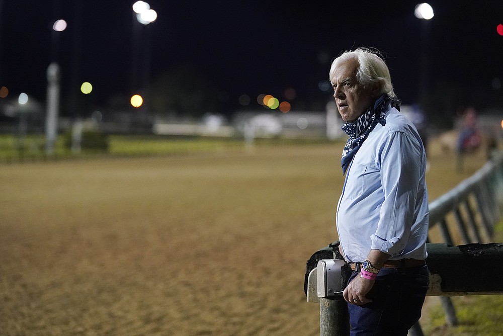 FILE - In this Sept. 4, 2020 file photo, trainer Bob Baffert watches at horses workout at Churchill Downs in Louisville, Ky. Baffert’s lawyer said Wednesday, June 2, 2021, that a split-sample test of Kentucky Derby winner Medina Spirit came back positive for the presence of the steroid betamethasone, which could lead to the horse’s disqualification and discipline for the Hall of Fame trainer. (AP Photo/Darron Cummings, File)