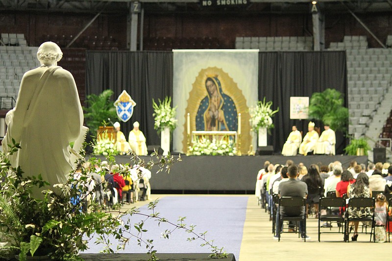 People witness the ordination of Omar Galvan Gonzalez, Emmanuel Torres, Benjamin Riley, Brian Cundall and Alex Smith to the Catholic priesthood on May 29. They were among the approximately 2,000 who attended the ceremony open to the public, the first ordination to be held at Barton Coliseum, and one of the most-attended events in the Little Rock Catholic diocese since before the start of the covid-19 pandemic in March 2020.
(Arkansas Democrat-Gazette/Francisca Jones)