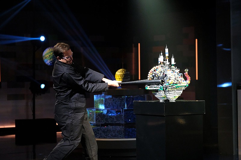 Host Will Arnett smashes a contestant’s Lego creation in “Lego Masters.” (Fox/TNS/Ray Mickshaw)